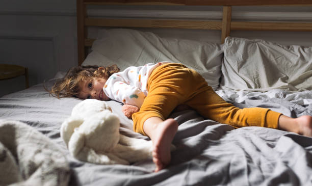 istock Little Girl Lying on bed 1194274286
