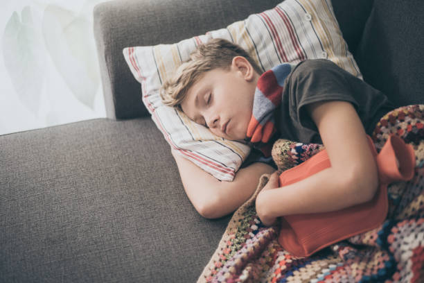 istock High Angle View Of Boy Sleeping On Sofa At Home 1194275772