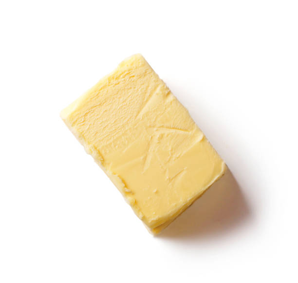 istock piece of butter isolated on white background, top view 1194276369