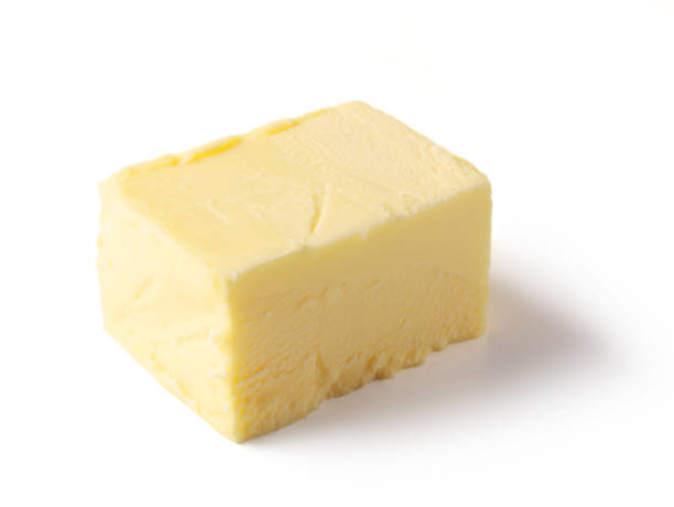 istock piece of butter isolated on white background 1194276372