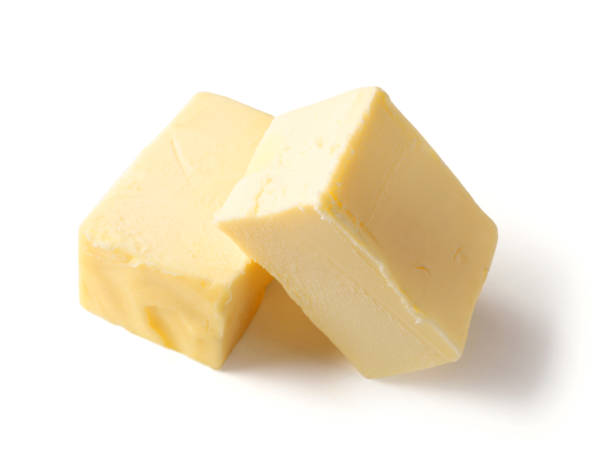 istock pieces of butter isolated on white background 1194276375