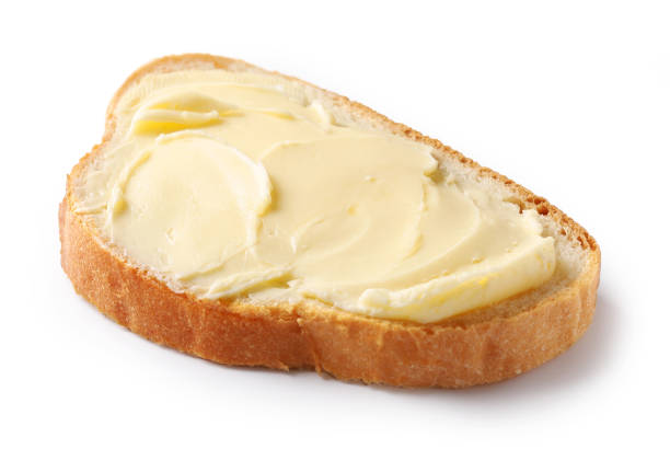 istock bread with butter isolated on white background, selective focus 1194277046