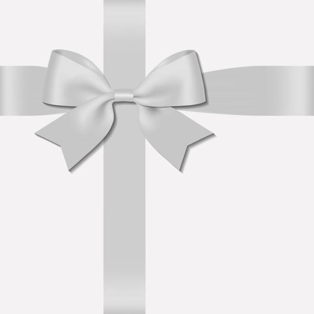 istock Realistic decorative shiny satin silver ribbon bow, isolated on white background 1194277677