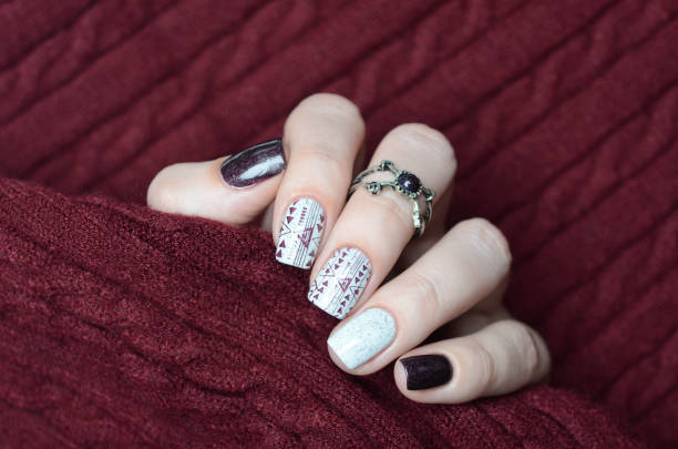 istock white wine plum manicure with geometric design 1194279303
