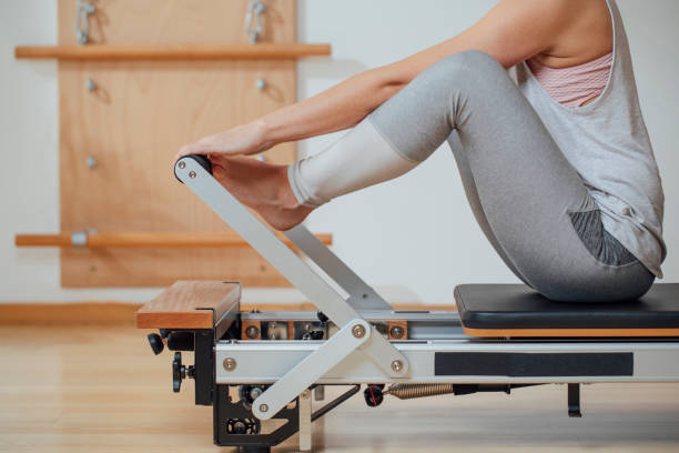 istock Sportswoman Doing Exercise on Pilates Reformer 1194282303