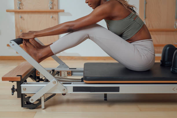 istock Woman Doing Pilates Exercise on Reformer 1194282309