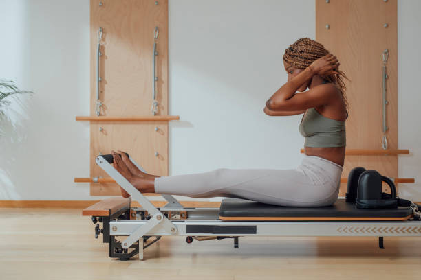 istock Woman Doing Pilates Exercise on Reformer 1194282310