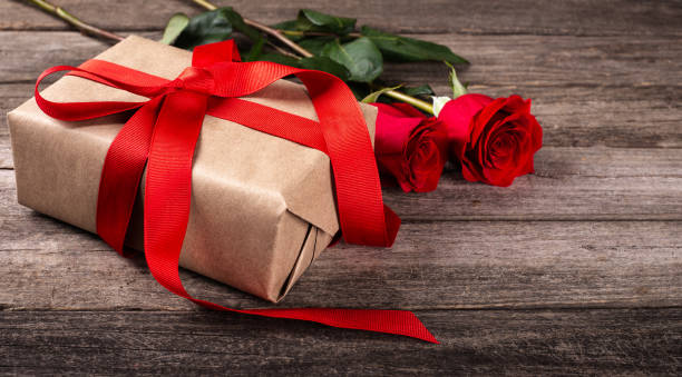 istock Valentine Gift With Red Roses 1194282513