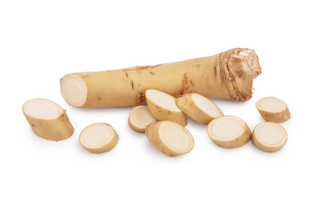 istock Horseradish root with slices isolated on white background 1194283136