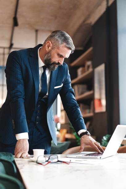 business man working with documents and laptop