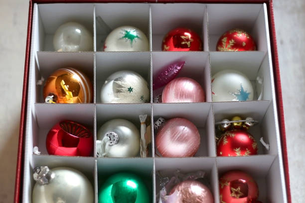 Organized Christmas Decorations Colorful vintage Christmas decorations organized in a box. Selective focus. christmas decoration storage stock pictures, royalty-free photos & images