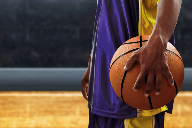 istock Basketball player holding a ball 1194288828