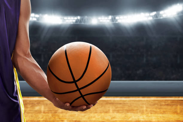 istock Basketball player holding a ball 1194289147