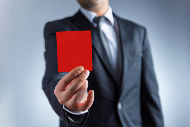 istock Businessman showing the red card 1194290545