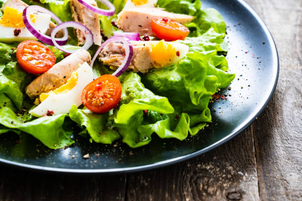 istock Tuna and vegetable salad  on wooden background 1194290763