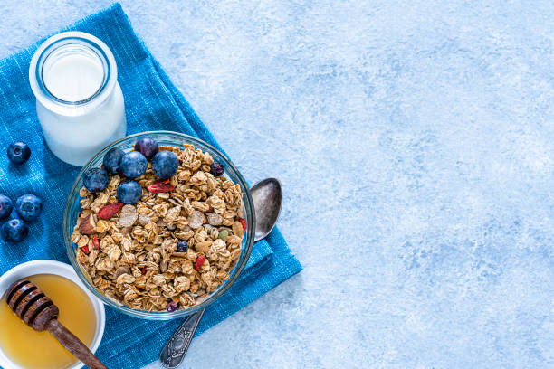 istock Healthy eating: granola bowl with fruits for breakfast. Top view with copy space 1194291156