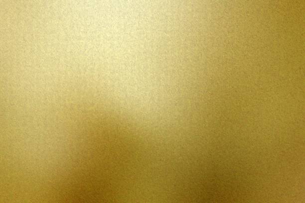 istock Gold foil metallic wall with scratched surface, abstract texture background 1194291191