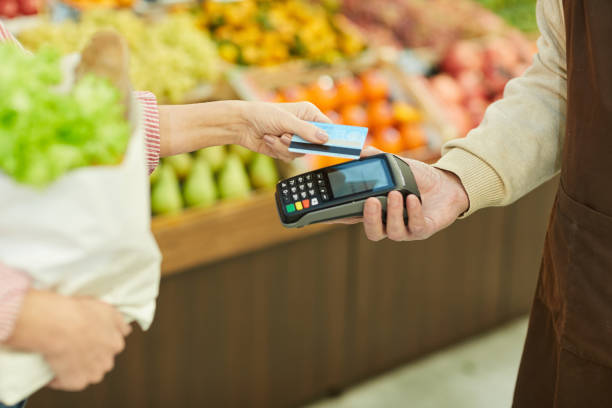 istock Smartphone Payment in Grocery Shop 1194292983