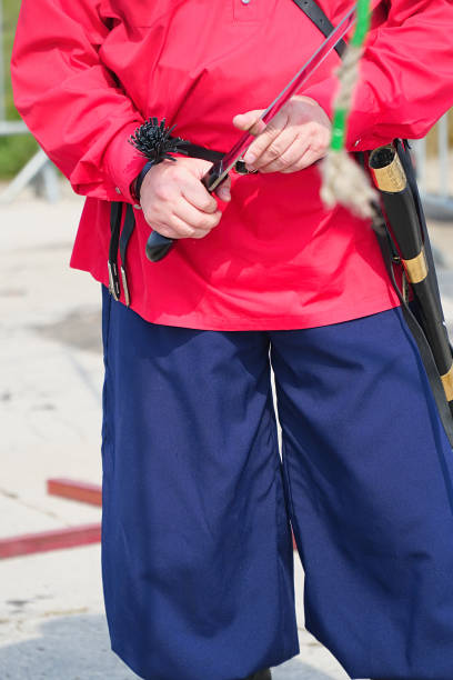 istock Cossack in red shirt holding a cavalry saber 1194293551