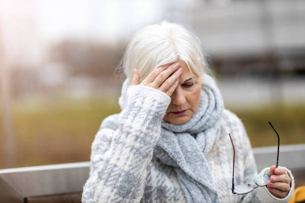 istock Senior woman suffering from a headache 1194294112