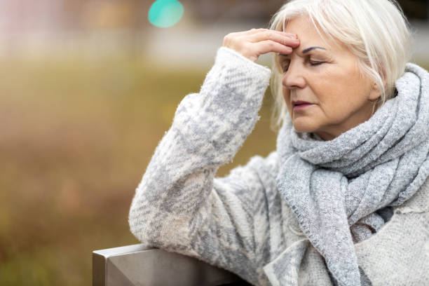 istock Senior woman suffering from a headache 1194294307