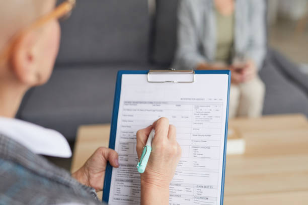 istock Female Psychologist Writing on Clipboard Close up 1194294358