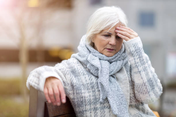 istock Senior woman suffering from a headache 1194294530