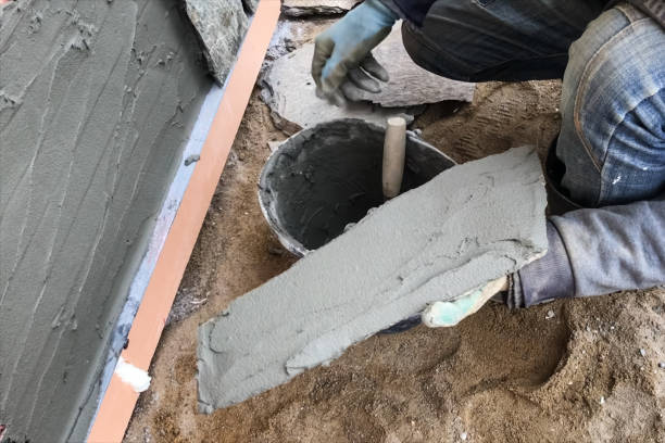 istock builder faces the basement of a house with a wild stone. Flat fo 1194295535