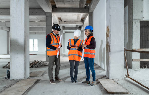 istock Investors Talking To Construction Foreman At A Construction Site 1194298786