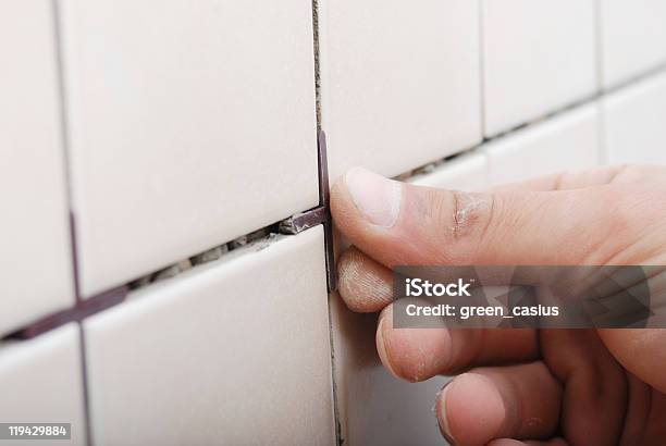 Man Installing Ceramic Tile Stock Photo - Download Image Now - Grout, Tiler, In A Row