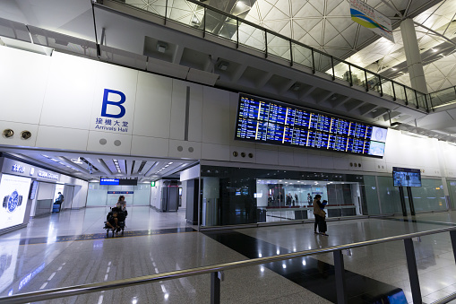 Hong Kong, Hong Kong - November 27, 2019 : People at Hong Kong International Airport. The airport has been commercially operational since 1998. It is operated by the Airport Authority Hong Kong.