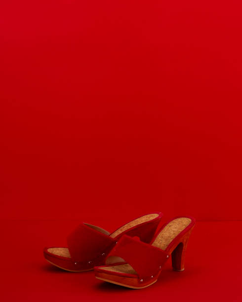 istock Red women shoes on a red background 1194300055