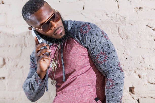 istock African-American man with bling on mobile phone 1194300711