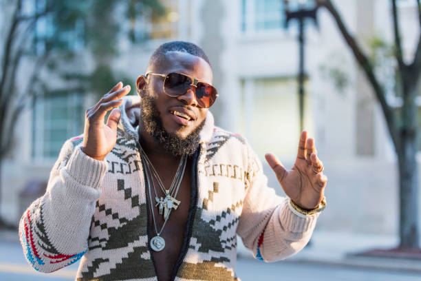 african-american man with gold grill on city street - hip hop urban scene city life black imagens e fotografias de stock