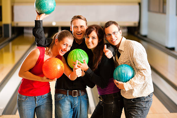 istock Friends bowling together 119430222