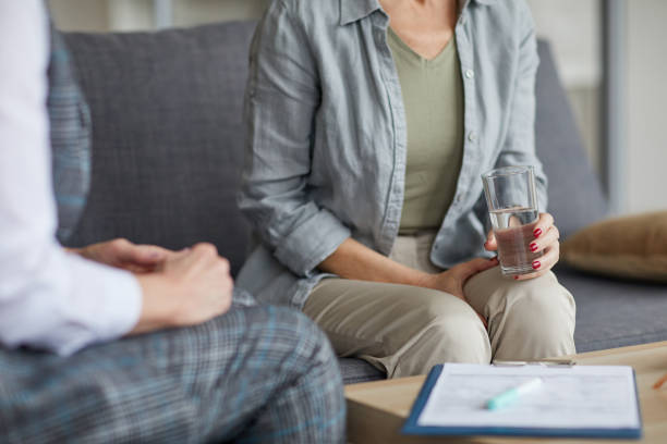 istock Cropped Image of Woman in Therapy Session 1194304775