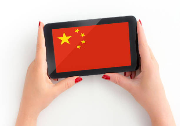 istock Woman her tablet with Chinese flag 1194305387
