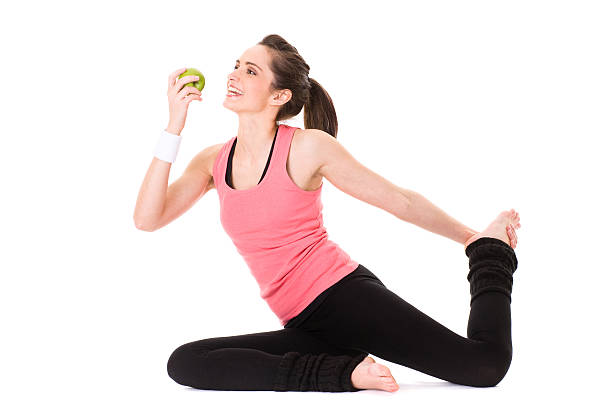 istock young attractive female with green apple, isolated on white 119430563