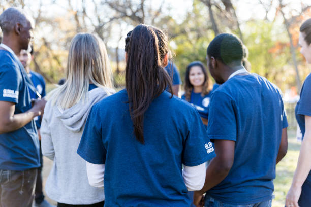 istock Volunteers receiving instructions during event 1194308417