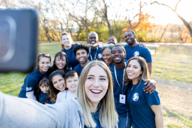 istock Neighbors take selfie after cleaning up community park 1194308437