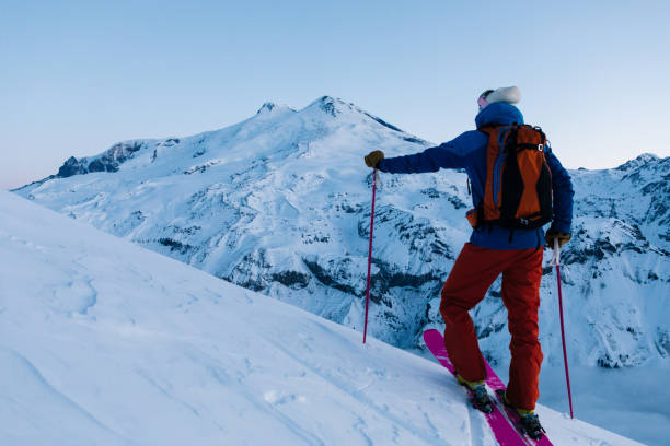 istock Backcountry skier ascends snowy ridge 1194309707