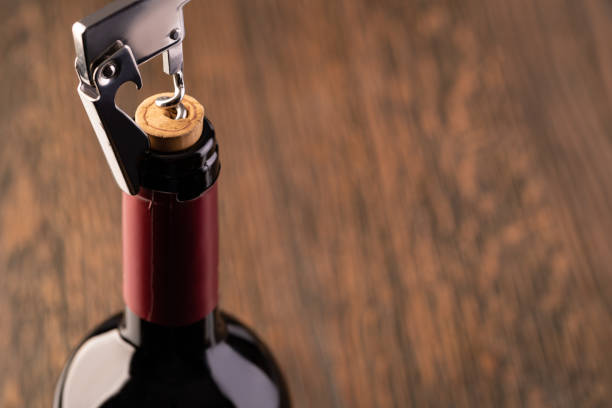 istock Corkscrew and bottle of wine 1194309819