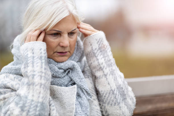 istock Senior woman suffering from a headache 1194312493