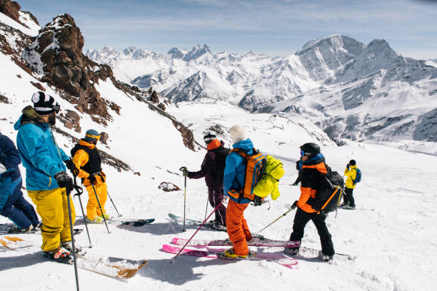 istock Backcountry skiers ascend snowy ridge 1194313048