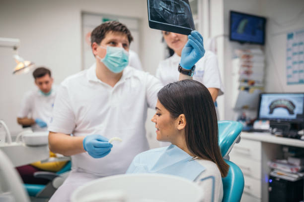 istock Dentist holding dental medical scan 1194315301