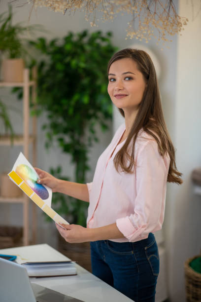 istock Beautiful creative woman choosing the best colour 1194316987