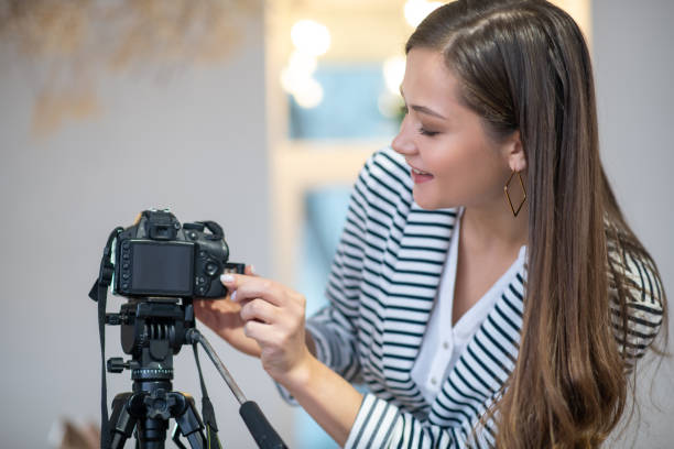 istock Positive long haired woman pressing a button on camera 1194317178
