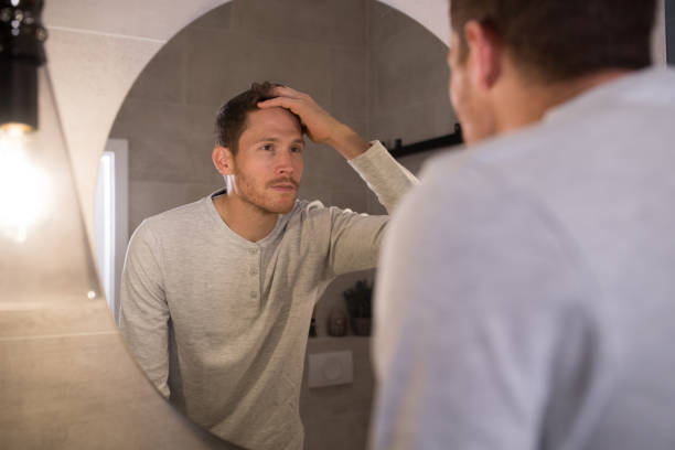 istock Reflection in the mirror of the handsome man 1194318228