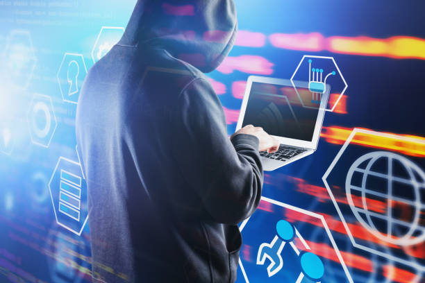 istock Rear view of hacker with laptop, futuristic GUI 1194318599