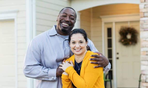 istock Happy interracial couple outside house 1194318649